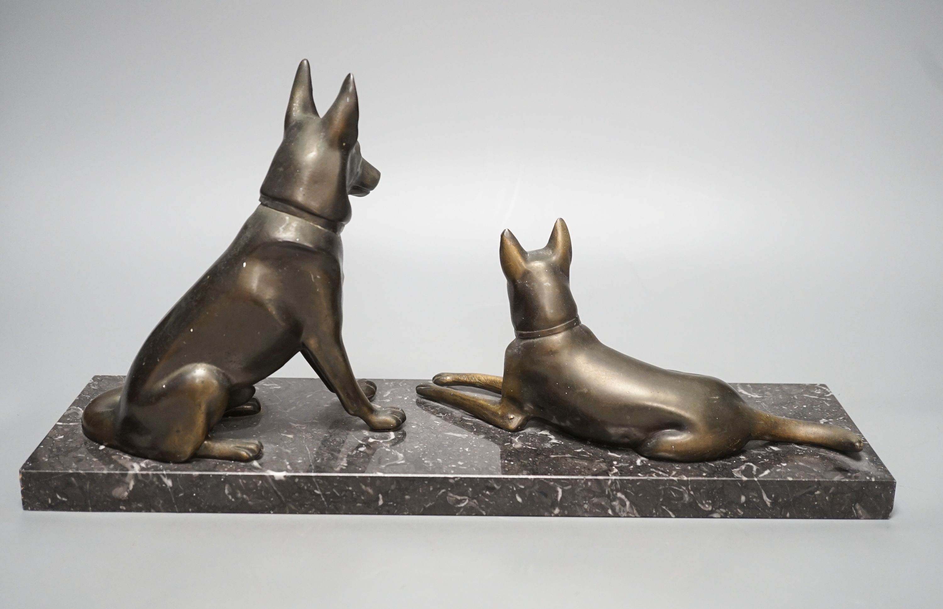 An Art Deco patinated spelter German Shepherd group, 40cm